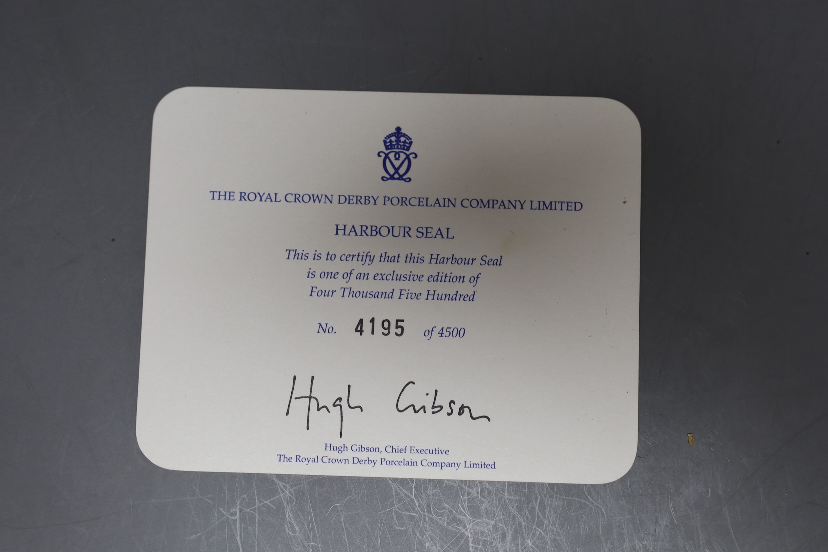 A Royal Crown Derby paperweight - Harbour Seal, gold stopper, boxed with certificate